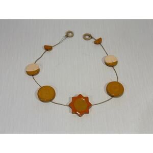 Handmade ceramic sun & moon-phase wall garland boho stoneware on jute ochre